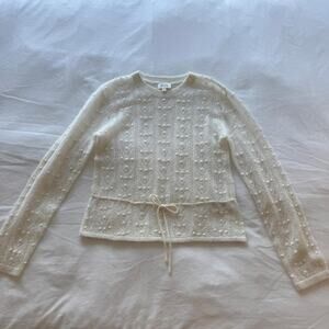 Sezane cream knit sweater with textured pattern and tie waist
